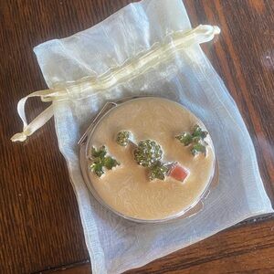 Elegant Compact Mirror with Green plant Accents